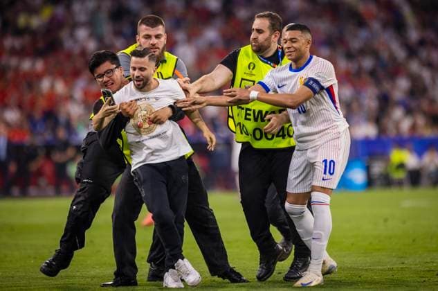 Munich, Germany 09th Jul 2024 Speedster takes a selfie with Kylian Mbappe FRA and is stopped by stewards Spain France Spain France 09 07 2024