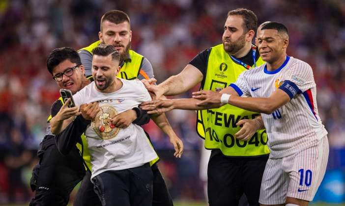 Munich, Germany 09th Jul 2024 Speedster takes a selfie with Kylian Mbappe FRA and is stopped by stewards Spain France Spain France 09 07 2024