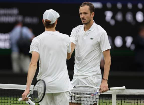 (240710) -- LONDON, July 10, 2024 -- Daniil Medvedev (R) of Russia greets with Jannik Sinner of Italy after their men s singles quarterfinal match at Wimbledon tennis Championship in London, Britain, July 9, 2024. ) (SP)BRITAIN-LONDON-TENNIS-WIMBLEDON-DAY 9 HanxYan 