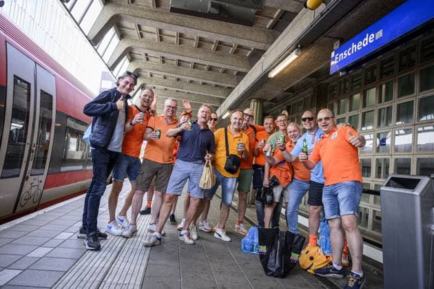 ENSCHEDE - Dutch fans at the Enschede railway station on their way to Dortmund on the day of the semi-final at the European Championship, EM, Europameisterschaft between the Netherlands and England. ANP EMIEL MUIDERMAN xVIxANPxSportx xxANPxIVx 503172250 originalFilename: 503172250.jpg