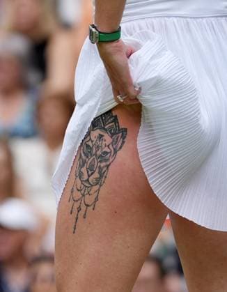 Lawn Tennis - 2024 Wimbledon Championship Ladies singles - Elena Rybakina (KAZ) v Elina Svitolina (UKR) All England Lawn Tennis & Croquet Club - Wednesday 10h July 2024 Elina Svitolina (UKR) with her leg tattoo 