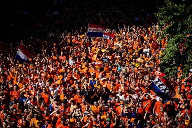DORTMUND - Orange supporters walk behind the Orange bus during the fan walk for the semi-final match at the European Championship, EM, Europameisterschaft between the Netherlands and England. ANP RAMON VAN FLYMEN xVIxANPxSportx xxANPxIVx 503192931 originalFilename: 503192931.jpg