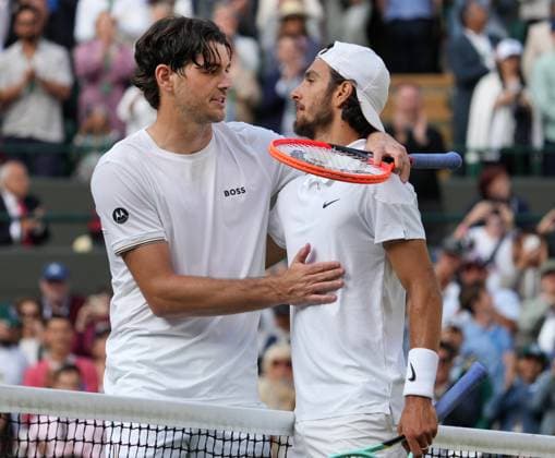 Lawn Tennis - 2024 Wimbledon Championship Mens singles - Lorenzo Musetti (ITA) v Taylor Fritz (USA) All England Lawn Tennis & Croquet Club - Wednesday 10h July 2024 Lorenzo Musetti (ITA) is congratulated by Taylor Fritz at the net after the mach 