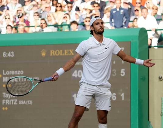 Lawn Tennis - 2024 Wimbledon Championship Mens singles - Lorenzo Musetti (ITA) v Taylor Fritz (USA) All England Lawn Tennis & Croquet Club - Wednesday 10h July 2024 Lorenzo Musetti (ITA) celebrates winning match point 