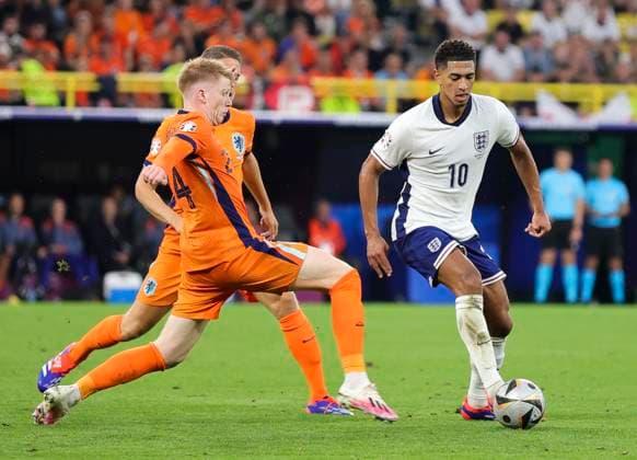 Netherlands v England UEFA EURO, EM, Europameisterschaft,Fussball 2024 Semi-final Jerdy Schouten of Netherlands pressures Jude Bellingham of England during the UEFA Euro 2024 Semi-final match between Netherlands and England at Signal Iduna Park, Dortmund UK Newspapers OUT Copyright: xPaulxChestertonx FIL-20342-0096