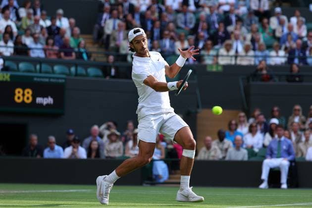 10th July 2024; All England Lawn Tennis and Croquet Club, London, England; Wimbledon Tennis Tournament, Day 10; Lorenzo Musetti (ITA) at the net against Taylor Fritz (USA), mens singles quarter final match  ActionPlus12666653 JohnxPatrickxFletcher
