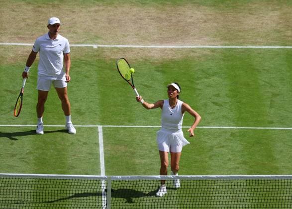 10th July 2024; All England Lawn Tennis and Croquet Club, London, England; Wimbledon Tennis Tournament, Day 10; Hsieh Su-wei (TWN) at the net against Heather Watson (GBR), mixed doubles round 16 match  ActionPlus12666690 JohnxPatrickxFletcher