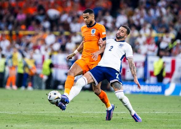 Dortmund, SignaI Iduna Park, 10 07 2024 Cody Gakpo of netherlands challenges Kyle Walker of england during the semifinal match Netherlands v England at the UEFA European Championship 2024