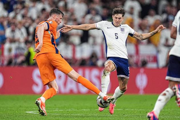 2024-07-10 Netherlands v England - Semi-Final - UEFA EURO, EM, Europameisterschaft,Fussball 2024 DORTMUND, GERMANY - JULY 10: Wout Weghorst of the Netherlands, John Stones of England fight for the ball during the Semi-Final - UEFA EURO 2024 match between Netherlands and England at BVB Stadion Dortmund on July 10, 2024 in Dortmund, Germany. (Photo by Joris Verwijst BSR Agency) Dortmund Germany Content not available for redistribution in The Netherlands directly or indirectly through any third parties. Copyright: xBSRxAgencyx