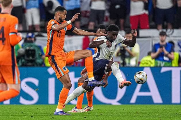 2024-07-10 Netherlands v England - Semi-Final - UEFA EURO, EM, Europameisterschaft,Fussball 2024 DORTMUND, GERMANY - JULY 10: Cody Gakpo of the Netherlands, Marc Guehi of England battle for the ball during the Semi-Final - UEFA EURO 2024 match between Netherlands and England at BVB Stadion Dortmund on July 10, 2024 in Dortmund, Germany. (Photo by Joris Verwijst BSR Agency) Dortmund Germany Content not available for redistribution in The Netherlands directly or indirectly through any third parties. Copyright: xBSRxAgencyx