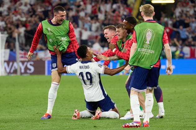 (240711) -- DORTMUND, July 11, 2024 -- Ollie Watkins (bottom) of England celebrates scoring with teammates during the UEFA EURO, EM, Europameisterschaft,Fussball 2024 semifinal match between England and the Netherlands in Dortmund, Germany on July 10, 2024. ) (SP)GERMANY-DORTMUND-FOOTBALL-EURO 2024-ENGLAND VS THE NETHERLANDS MengxDingbo 