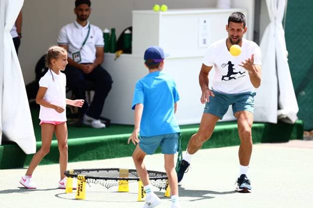 Novak Djokovic exercising with his children Wimbledon Tennis Championships, Day 11, The All England Lawn Tennis and Croquet Club, London, UK - 11 Jul 2024  Copyright: xJamesxMarsh Shutterstockx 14580282ac