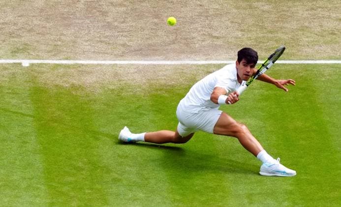 Carlos Alcaraz slides during his semi final match Wimbledon Tennis Championships, Day 12, The All England Lawn Tennis and Croquet Club, London, UK - 12 Jul 2024  Copyright: xJavierxGarcia Shutterstockx 14581882as
