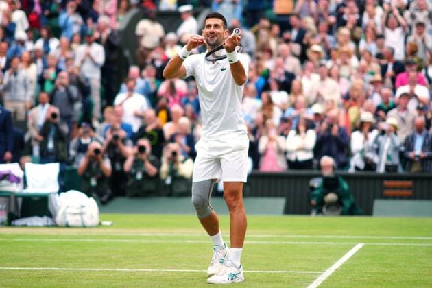 Novak Djokovic celebrates by playing the violin after winning his semi final match Wimbledon Tennis Championships, Day 12, The All England Lawn Tennis and Croquet Club, London, UK - 12 Jul 2024  Copyright: xJavierxGarcia Shutterstockx 14581882ig