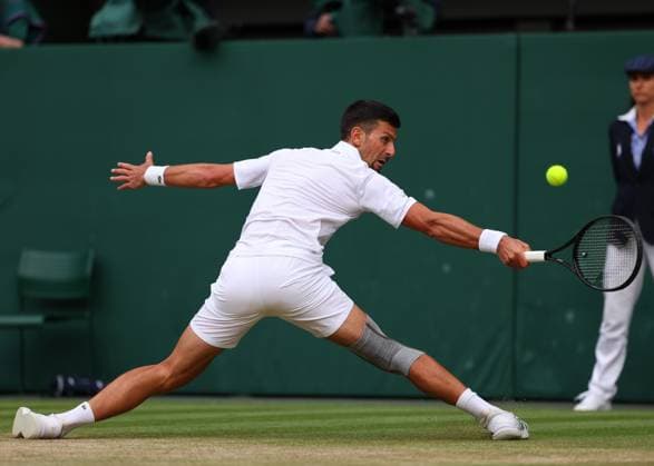 12th July 2024; All England Lawn Tennis and Croquet Club, London, England; Wimbledon Tennis Tournament, Day 12; Novak Djokovic (SRB) returns against Lorenzo Musetti (ITA), Gentlemens Singles Semi Finals  ActionPlus12667209 JohnxPatrickxFletcher