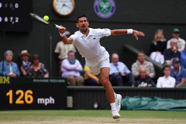 12th July 2024; All England Lawn Tennis and Croquet Club, London, England; Wimbledon Tennis Tournament, Day 12; Novak Djokovic (SRB) stretches to return against Lorenzo Musetti (ITA), Gentlemens Singles Semi Finals  ActionPlus12667220 JohnxPatrickxFletcher
