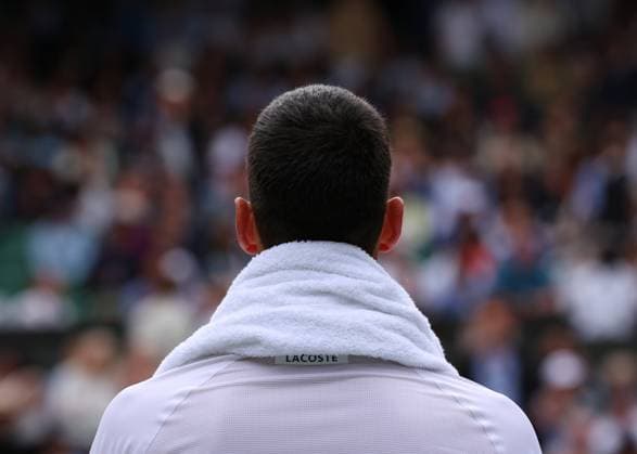 12th July 2024; All England Lawn Tennis and Croquet Club, London, England; Wimbledon Tennis Tournament, Day 12; Novak Djokovic (SRB) taking a rest during a break in play against Lorenzo Musetti (ITA), Gentlemens Singles Semi Finals  ActionPlus12667228 JohnxPatrickxFletcher