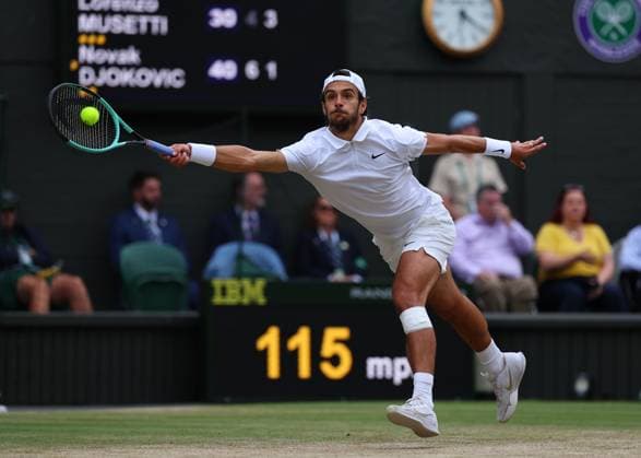 12th July 2024; All England Lawn Tennis and Croquet Club, London, England; Wimbledon Tennis Tournament, Day 12; Lorenzo Musetti (ITA) stretches to return from the baseline against Novak Djokovic (SRB), Gentlemens Singles Semi Finals  ActionPlus12667234 JohnxPatrickxFletcher