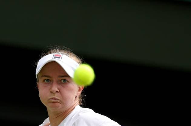 (240713) -- LONDON, July 13, 2024 -- Barbora Krejcikova hits a return during the women s singles final between Barbora Krejcikova of Czech Republic and Jasmine Paolini of Italy at Wimbledon tennis Championship in London, Britain, July 13, 2024. ) (SP)BRITAIN-LONDON-TENNIS-WIMBLEDON--WOMEN S SINGLES-FINAL LixYing 