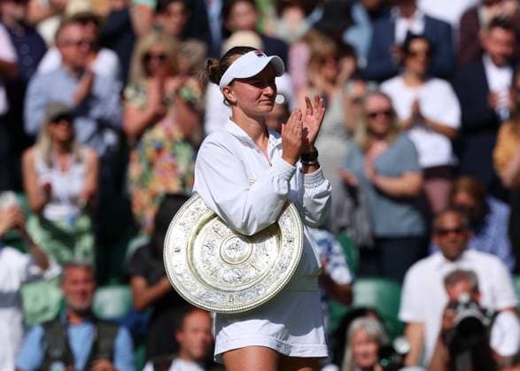 13th July 2024; All England Lawn Tennis and Croquet Club, London, England; Wimbledon Tennis Tournament, Day 13; Barbora Krejcikova (CZE) with the ladies single plate trophy applauding Jasmine Paolini (ITA) as the Italian runner up leaves Centre Court  ActionPlus12667499 JohnxPatrickxFletcher