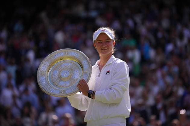 LONDON, ENGLAND - JULY 13: Barbora Krejcikova of Czechia celebrates with the Ladies Singles Trophy following victory against Jasmine Paolini of Italy in the Ladies Singles Final match during day thirteen of The Championships Wimbledon 2024 at All England Lawn Tennis and Croquet Club on July 13, 2024 in London, England.  Copyright: xHiroshixSatox