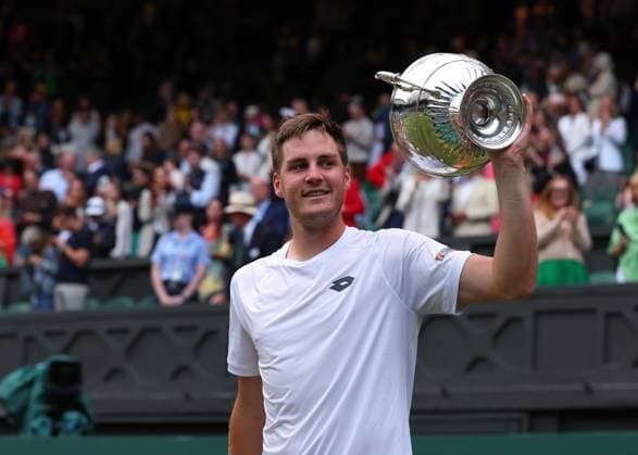 13th July 2024; All England Lawn Tennis and Croquet Club, London, England; Wimbledon Tennis Tournament, Day 13; Henry Patten (GBR) celebrates lifting the Gentlemen& x2019;s Doubles Trophy in front of the Centre Court spectators after defeating Max Purcell (AUS) and Jordan Thompson (AUS)  ActionPlus12667618 JohnxPatrickxFletcher