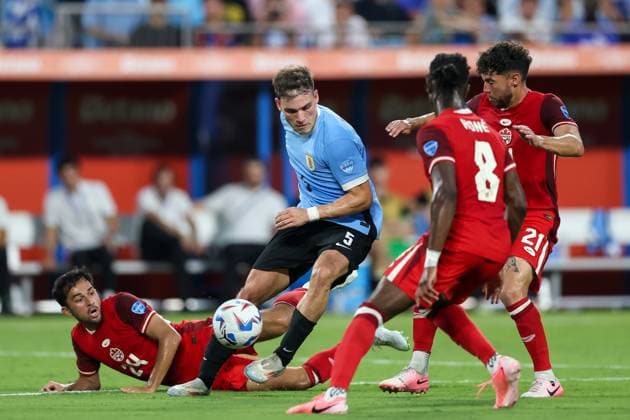 July 13, 2024, Charlotte, North Carolina, U.S: Uruguay midfielder MANUEL UGARTE (5) drives the ball past Canada midfielder MATHIEU CHOINIERE (24) during the first half of the CONMEBOL Copa America match between Uruguay and Canada at Bank of America Stadium in Charlotte, NC on July 13, 2024. Charlotte U.S - ZUMAk149 20240713_zsp_k149_019 Copyright: xCoryxKnowltonx