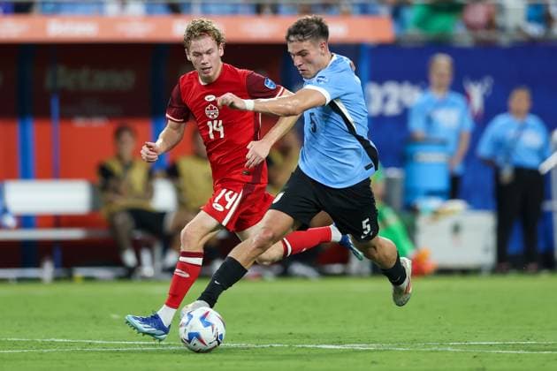 July 13, 2024, Charlotte, North Carolina, U.S: Uruguay midfielder MANUEL UGARTE (5) competes for the ball against Canada forward JACOB SHAFFELBURG (14) during the first half of the CONMEBOL Copa America match between Uruguay and Canada at Bank of America Stadium in Charlotte, NC on July 13, 2024. Charlotte U.S - ZUMAk149 20240713_zsp_k149_020 Copyright: xCoryxKnowltonx