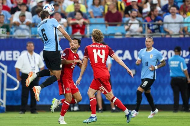July 13, 2024, Charlotte, North Carolina, U.S: Uruguay midfielder RODRIGO BENTANCUR (6) gets a header during the first half of the CONMEBOL Copa America match between Uruguay and Canada at Bank of America Stadium in Charlotte, NC on July 13, 2024. Charlotte U.S - ZUMAk149 20240713_zsp_k149_031 Copyright: xCoryxKnowltonx