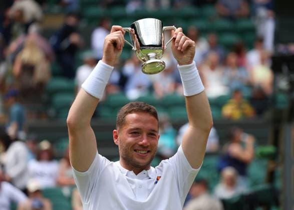 14th July 2024; All England Lawn Tennis and Croquet Club, London, England; Wimbledon Tennis Tournament, Day 14; Alfie Hewett (GBR) lifts the Gentlemen Wheelchair Singles trophy after defeating Martin De La Puente (ESP) in straight sets  ActionPlus12667777 JohnxPatrickxFletcher