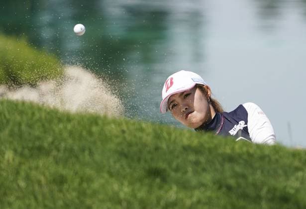 Golf: Evian Championship Ayaka Furue of Japan hits out of a bunker on the fifth hole during the final round of the Evian championship golf tournament at Evian Resort Golf Club in Evian-les-Bains, France, on July 14, 2024.  A14AA0003134383P
