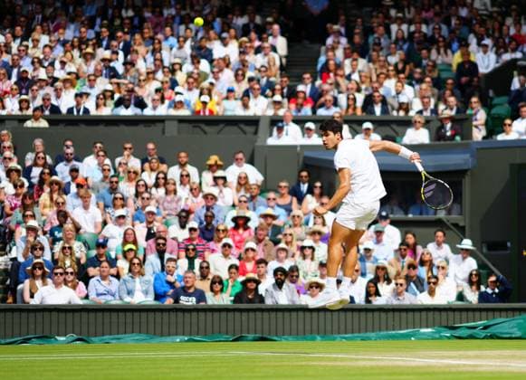 Carlos Alcaraz plays a shot behind his back during the Gentlemen s Singles final Wimbledon Tennis Championships, Day 14, The All England Lawn Tennis and Croquet Club, London, UK - 14 Jul 2024  Copyright: xJavierxGarcia Shutterstockx 14584814co