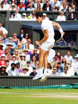 Carlos Alcaraz plays a shot behind his back during the Gentlemen s Singles final Wimbledon Tennis Championships, Day 14, The All England Lawn Tennis and Croquet Club, London, UK - 14 Jul 2024  Copyright: xJavierxGarcia Shutterstockx 14584814cm