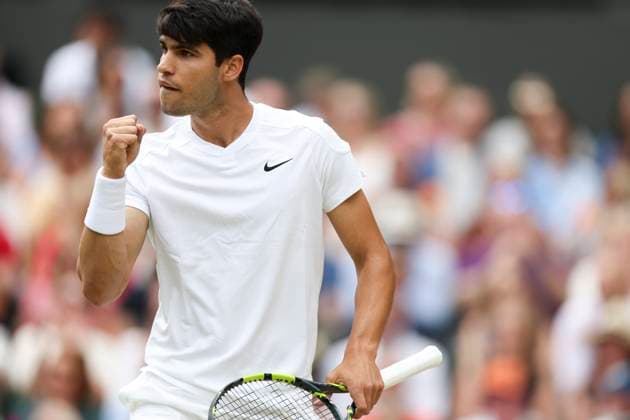 (240714) -- LONDON, July 14, 2024 -- Carlos Alcaraz celebrates scoring during the men s singles final between Carlos Alcaraz of Spain and Novak Djokovic of Serbia at Wimbledon tennis Championship in London, Britain, July 14, 2024. ) (SP)BRITAIN-LONDON-TENNIS-WIMBLEDON-MEN S SINGLES-FINAL HanxYan 