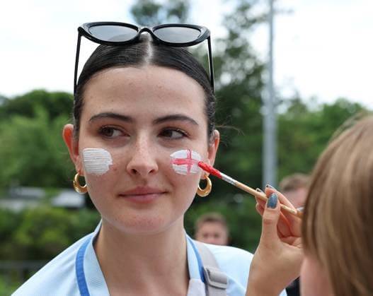 Berlin, Germany, 14th July 2024. An England fan has her face painted as he arrives prior to the UEFA European Championships final match at Olympiastadion, Berlin. Picture: Paul Terry Sportimage EDITORIAL USE ONLY. No use with unauthorised audio, video, data, fixture lists, club league logos or live services. Online in-match use limited to 120 images, no video emulation. No use in betting, games or single club league player publications. SPI-3227-0017