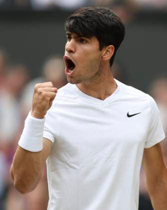 (240714) -- LONDON, July 14, 2024 -- Carlos Alcaraz celebrates scoring during the men s singles final between Carlos Alcaraz of Spain and Novak Djokovic of Serbia at Wimbledon tennis Championship in London, Britain, July 14, 2024. ) (SP)BRITAIN-LONDON-TENNIS-WIMBLEDON-MEN S SINGLES-FINAL HanxYan 