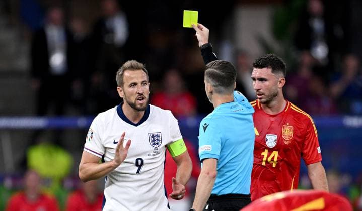 Football Euro 2024 Final 14 07 2024 Spain England Harry Kane left, England gets the yellow card from referee Francois Letexier center, FRA, France next to Aymeric Laporte right, Spain