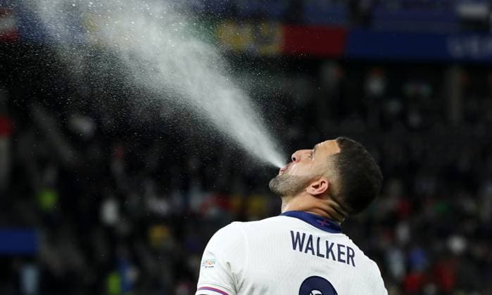 Kyle Walker spits water into the air Sport Football Soccer European Championship Euro 2024 European Championship Final Men Season 2023 2024 14 07 2024 Spain ESP vs England ENG in Berlin Olympiastadion DFL regulations prohibit any use of photographs as image sequences and or quasi video