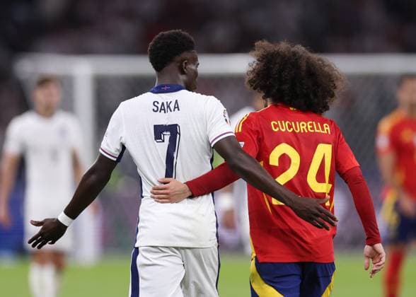 Berlin, Germany, 14th July 2024. Bukayo Saka of England and Marc Cucurella of Spain embrace during the UEFA European Championships final match at Olympiastadion, Berlin. Picture credit should read: David Klein Sportimage EDITORIAL USE ONLY. No use with unauthorised audio, video, data, fixture lists, club league logos or live services. Online in-match use limited to 120 images, no video emulation. No use in betting, games or single club league player publications. SPI-3228-0141