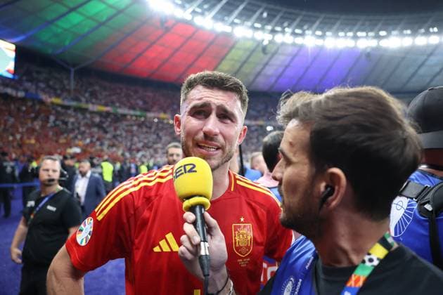 Berlin, Germany, 14th July 2024. Aymeric Laporte of Spain is interviewed at the final whistle during the UEFA European Championships final match at Olympiastadion, Berlin. Picture: Paul Terry Sportimage EDITORIAL USE ONLY. No use with unauthorised audio, video, data, fixture lists, club league logos or live services. Online in-match use limited to 120 images, no video emulation. No use in betting, games or single club league player publications. SPI-3227-0125