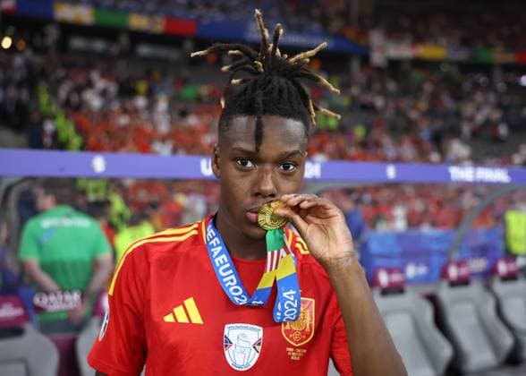 Berlin, Germany, 14th July 2024. Nico Williams of Spain with his winners medal during the UEFA European Championships final match at Olympiastadion, Berlin. Picture credit should read: David Klein Sportimage EDITORIAL USE ONLY. No use with unauthorised audio, video, data, fixture lists, club league logos or live services. Online in-match use limited to 120 images, no video emulation. No use in betting, games or single club league player publications. SPI-3228-0162