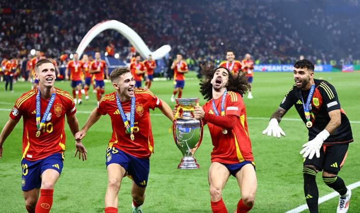 Dani Olmo, Marc Cucurella, Fermin Lopez and David Raya of Spain celebrate winning the 2024 UEFA European Football Championship with the Trophy Spain v England, UEFA European Championship, EM, Europameisterschaft 2024, Final, Football, Olympiastadion, Berlin, Germany, 14 Jul 2024 EDITORIAL USE ONLY No use with unauthorised audio, video, data, fixture lists, club league logos or live services. Online in-match use limited to 120 images, no video emulation. No use in betting, games or single club league player publications.  Copyright: xMichaelxZemanek Shutterstockx 14583343fg
