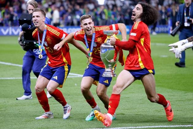CUCURELLA Marc Team Spain at the award ceremony with the winners trophy with OLMO Dani and VIVIAN Daniel European Championships 2024 Germany EURO 2024 Match Final SPA 2 1 on 14 07 2024 in Berlin DFL REGULATIONS PROHIBIT ANY USE OF PHOTOGRAPHS as IMAGE SEQUENCES and or QUASI VIDEO Copyright: xLacixPerenyix