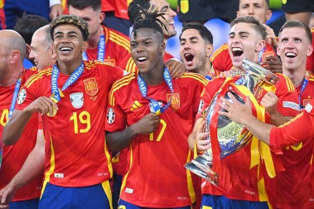 from left Yamal LAMINE ESP , Nico WILLIAMS ESP , Fermin LOPEZ ESP with trophy,cup,trophaee, jubilation,joy,enthusiasm, award ceremony FINAL Spain ESP England ENG 2 1 on 14 07 2024, Olympiastadion Berlin Football UEFA EURO 2024 GERMANY from 14 06 2024 14 07 2024