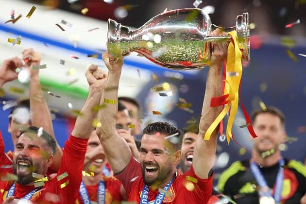 Berlin, Germany, 14th July 2024. Nacho of Spain lifts the trophy during the UEFA European Championships final match at Olympiastadion, Berlin. Picture: Paul Terry Sportimage EDITORIAL USE ONLY. No use with unauthorised audio, video, data, fixture lists, club league logos or live services. Online in-match use limited to 120 images, no video emulation. No use in betting, games or single club league player publications. SPI-3227-0175