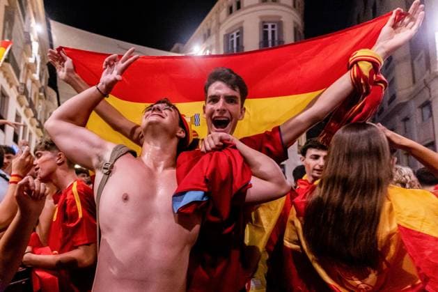 July 15, 2024, Malaga, Spain: Two Spain football fans seen celebrating at Marques de Larios street in Malaga the victory of Spain at the UEFA EURO, EM, Europameisterschaft,Fussball 2024. Spain won the UEFA Euro 2024 after a match against England celebrated at Olympiastadion in Berlin, Germany. Malaga Spain - ZUMAs197 0711375861st Copyright: xFrancisxGonzalezx
