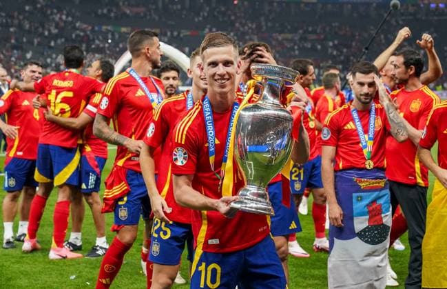 Spain v England Spain Forward Dani Olmo Leipzig celebrates winning with trophy during the Spain v England UEFA EURO, EM, Europameisterschaft,Fussball 2024 Final at the Olympiastadion Stadium, Berlin, Germany on 14 July 2024 Editorial use only. All images are copyright Every Second Media Limited. No images may be reproduced without prior permission. Copyright: xIMAGO EveryxSecondxMediax ESM-1060-0220