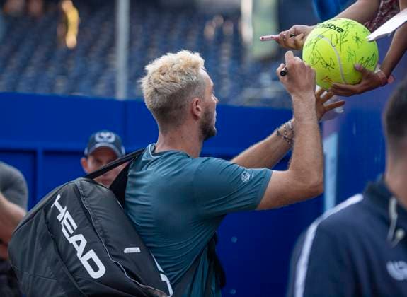 July 17, 2024, Gstaad, Bern, Switzerland: Gstaad Switzerland, 07 17 2024: JAN-LENNARD STRUFF of Germany signs autographs for fans during 8th finals of EFG Swiss Open Gstaad ATP, Tennis Herren 250, EFG Swiss Open Gstaad-ATP 250 at Roy Emerson Arena..JAN-LENNARD STRUFF won 7-6,7-6. Gstaad Switzerland - ZUMAd206 20240717_zip_d206_034 Copyright: xEricxDubostx