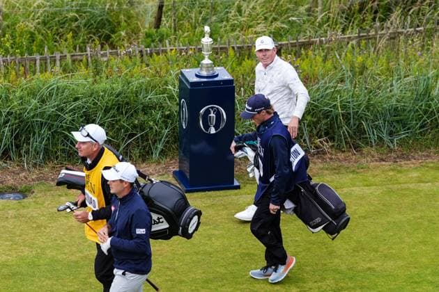 Jason Leonard (USA) walks past the Claret Jug after playing the first tee shot of the 2024 Open Championship at 06:35 with playing partners Todd Hamilton (USA) & Jack McDonald (SCO). The British Open Championship, Day One, Golf, Royal Troon, Troon, UK - 18 July 2024  Copyright: xStuartxWallace Shutterstockx 14588001i