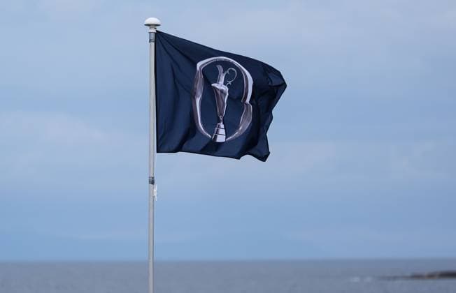 A flag with The Open Claret Jug logo flutters in the breeze at Royal Troon. The British Open Championship, Day One, Golf, Royal Troon, Troon, UK - 18 July 2024  Copyright: xStuartxWallace Shutterstockx 14588001j